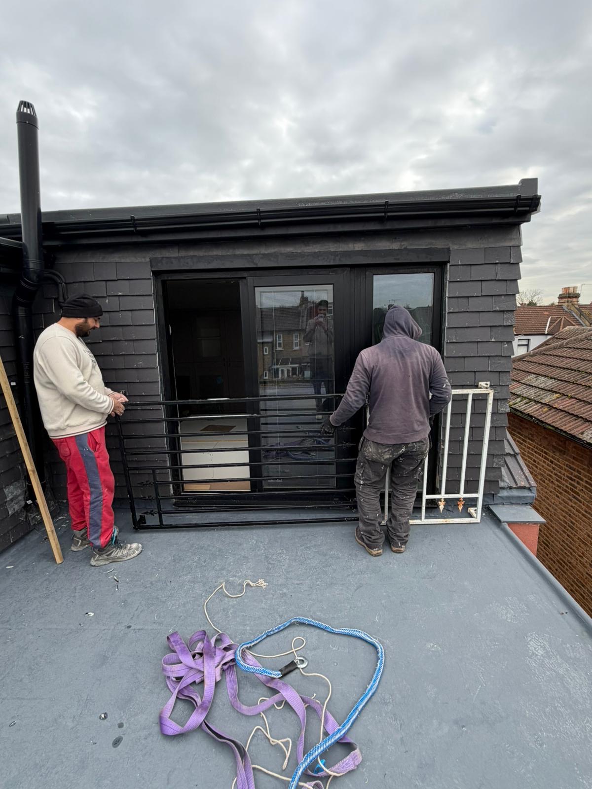 House roof construction with tiles and skylights