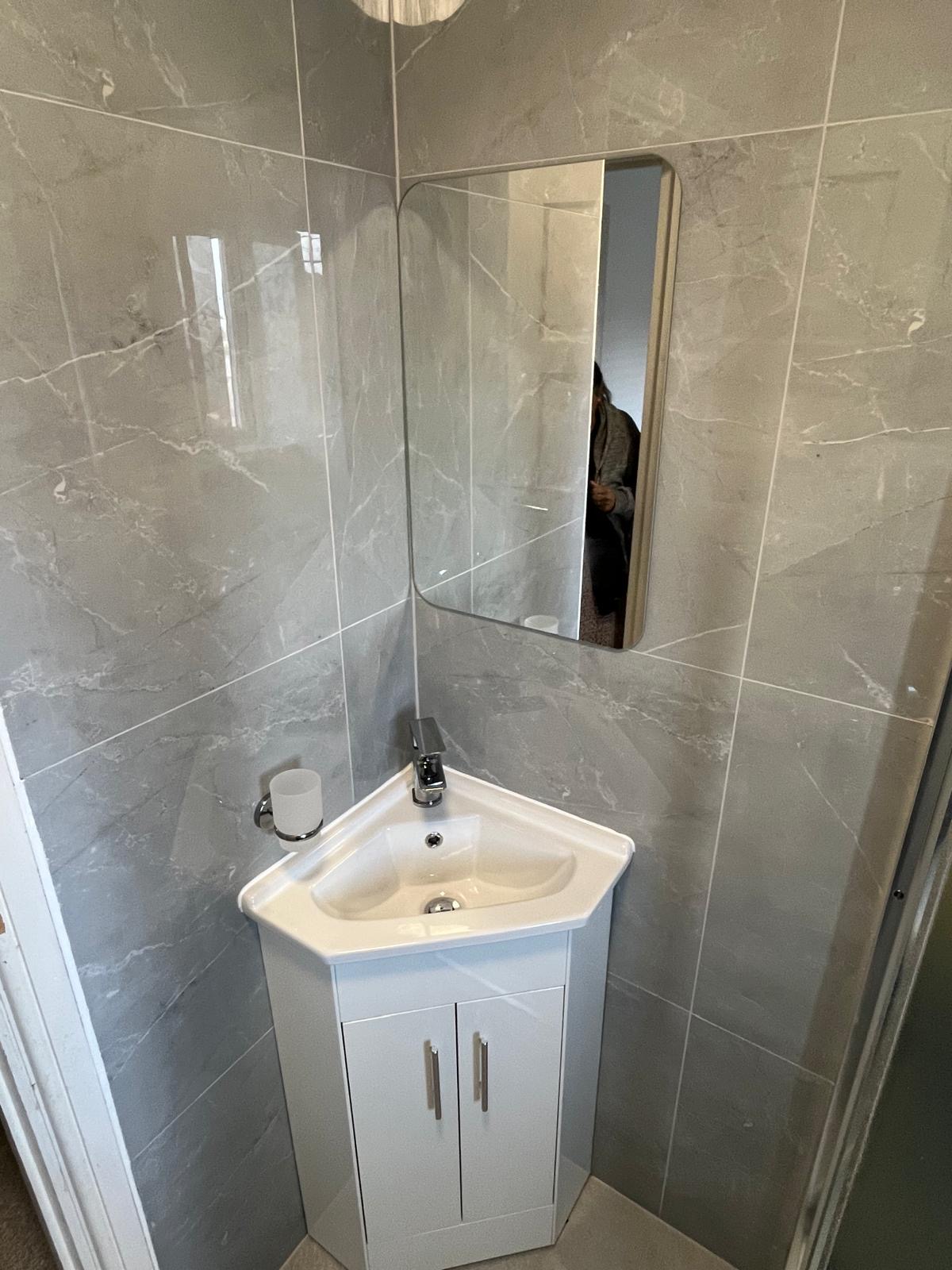 Modern washroom designed with premium marble walls and sleek fittings