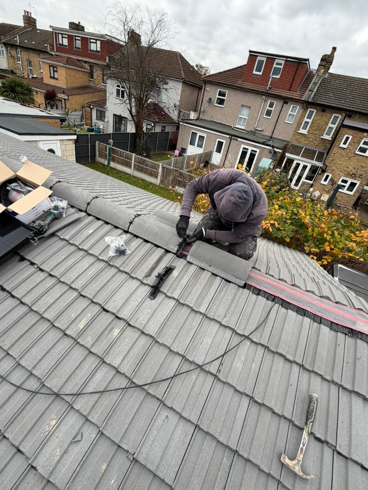 House roof construction with tiles and skylights