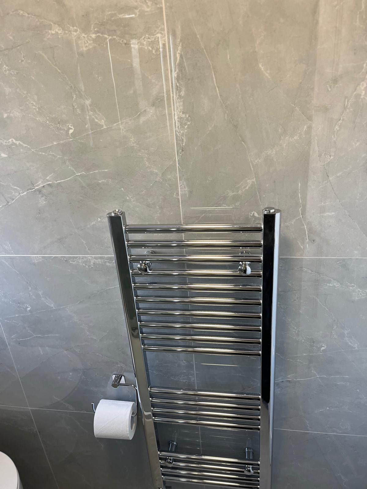 Modern washroom designed with premium marble walls and sleek fittings