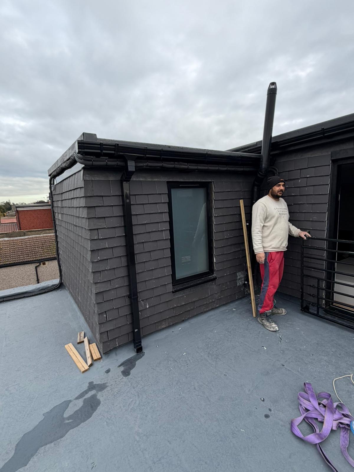 House roof construction with tiles and skylights