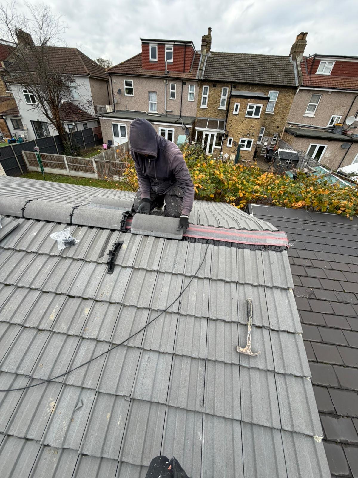 House roof construction with tiles and skylights