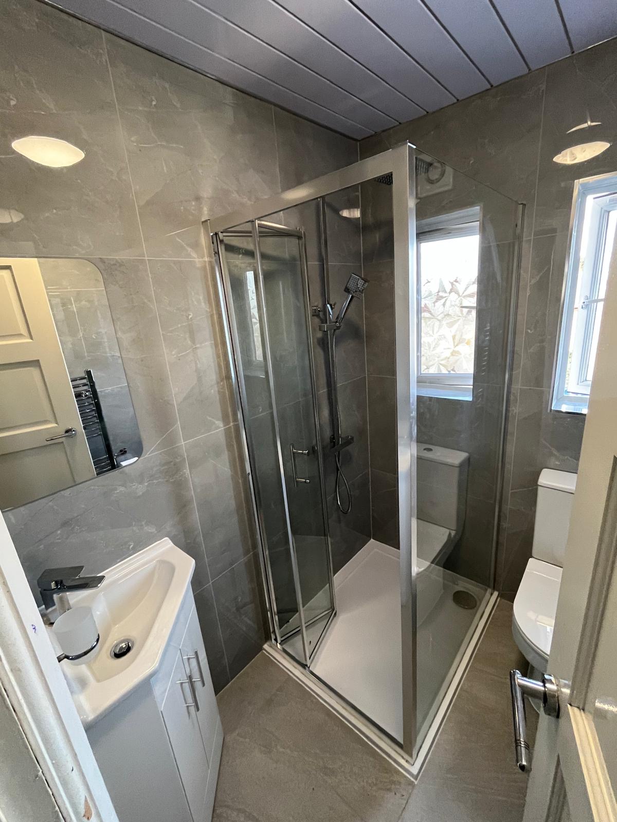 Modern washroom designed with premium marble walls and sleek fittings