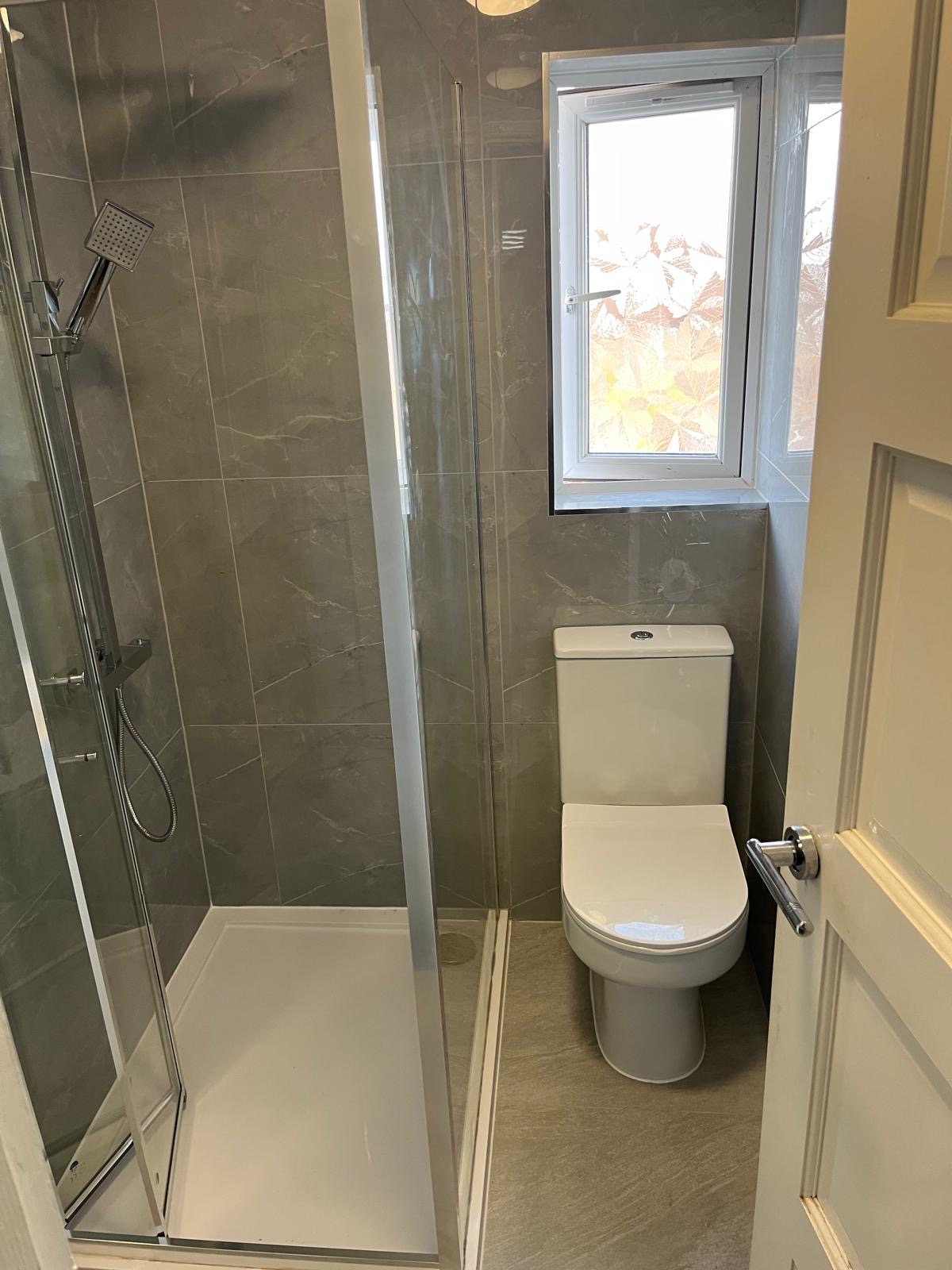 Modern washroom designed with premium marble walls and sleek fittings